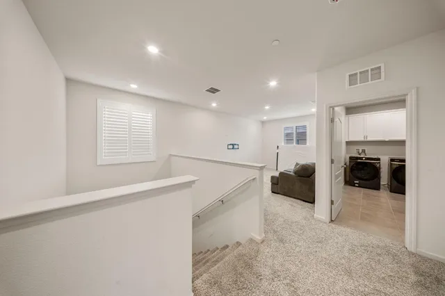 a kitchen with a white cabinets and white appliances