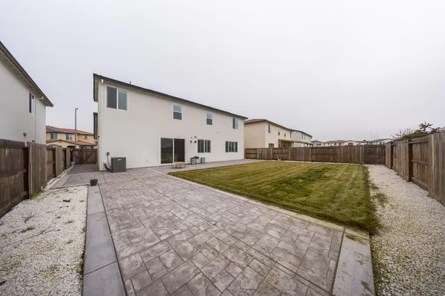 a view of a patio with a yard