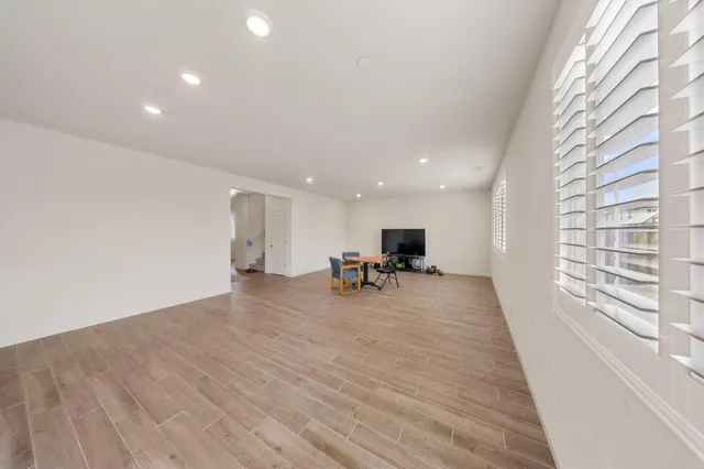 a view of a livingroom with furniture and wooden floor