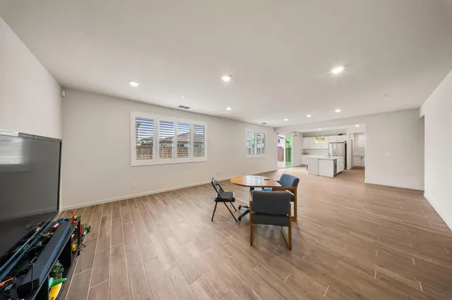 a livingroom with workspace and a window