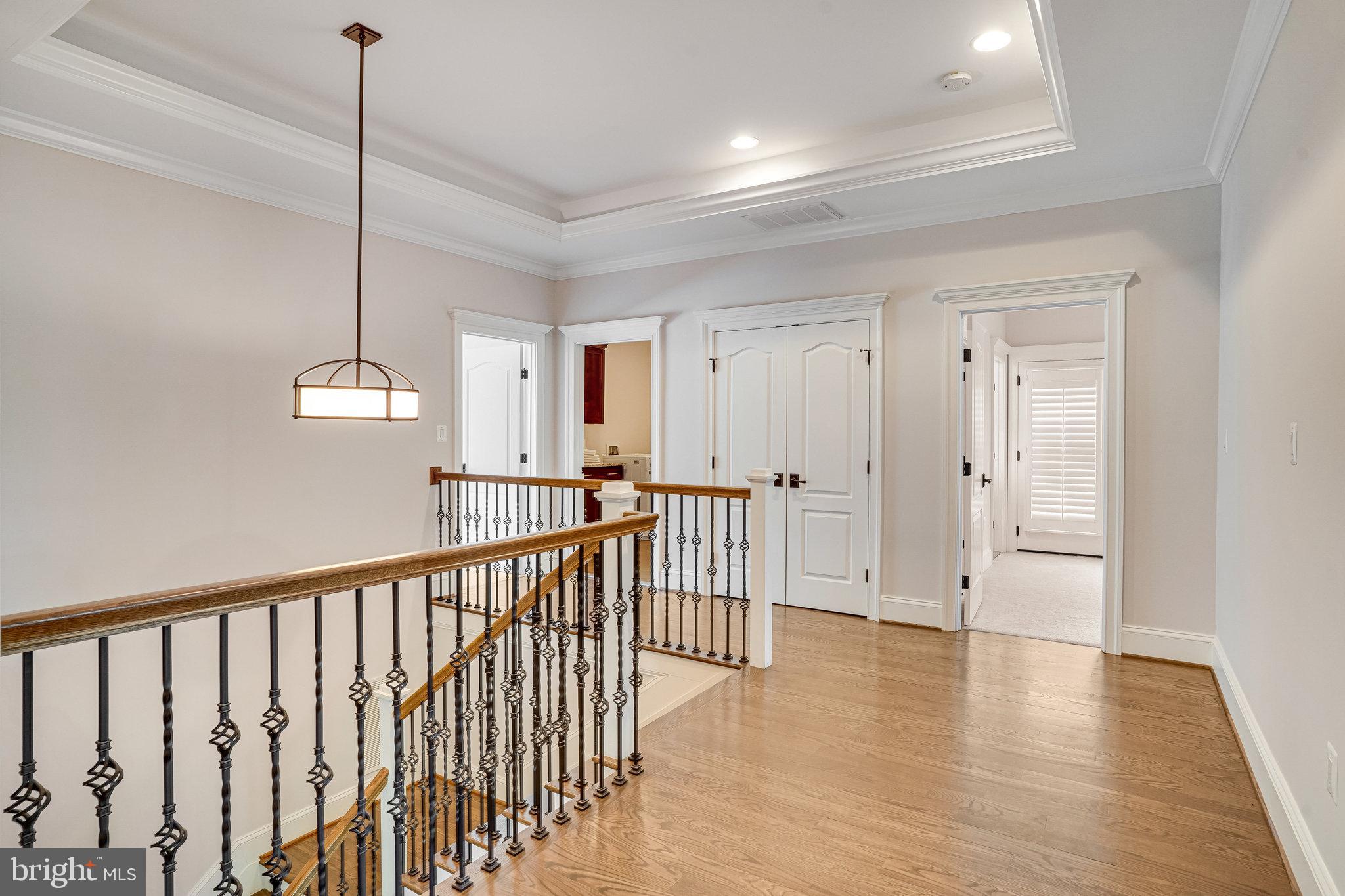 920 Ninovan Road Southeast Vienna, VA 22180 - Photo 20 of 44 a view of a hallway with wooden floor and stairs