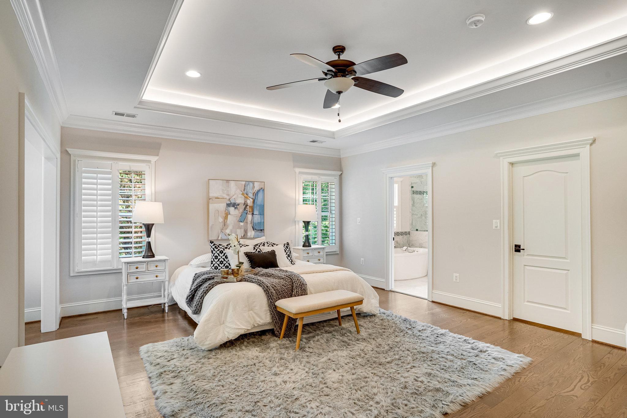 920 Ninovan Road Southeast Vienna, VA 22180 - Photo 23 of 44 a bedroom with a bed and wooden floor