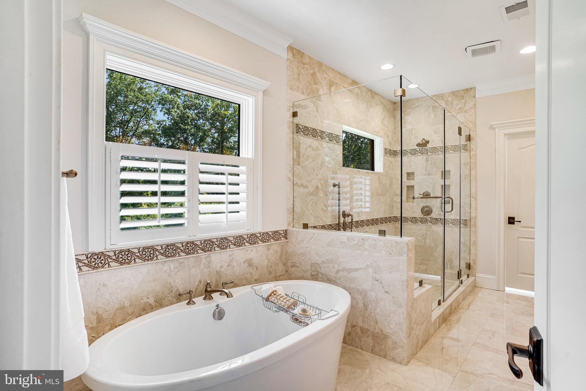 920 Ninovan Road Southeast Vienna, VA 22180 - Photo 26 of 44 a bathroom with a bathtub and a shower
