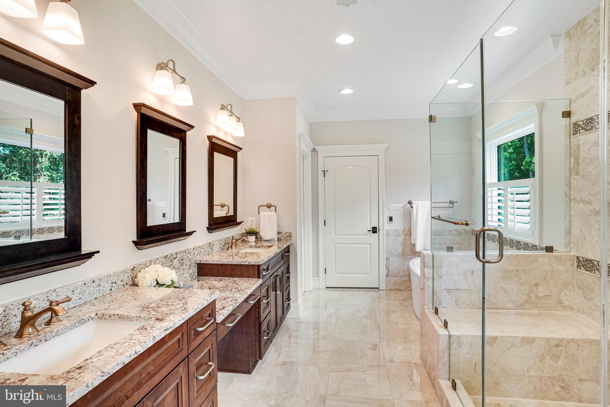920 Ninovan Road Southeast Vienna, VA 22180 - Photo 28 of 44 a bathroom with a granite countertop sink mirror and a