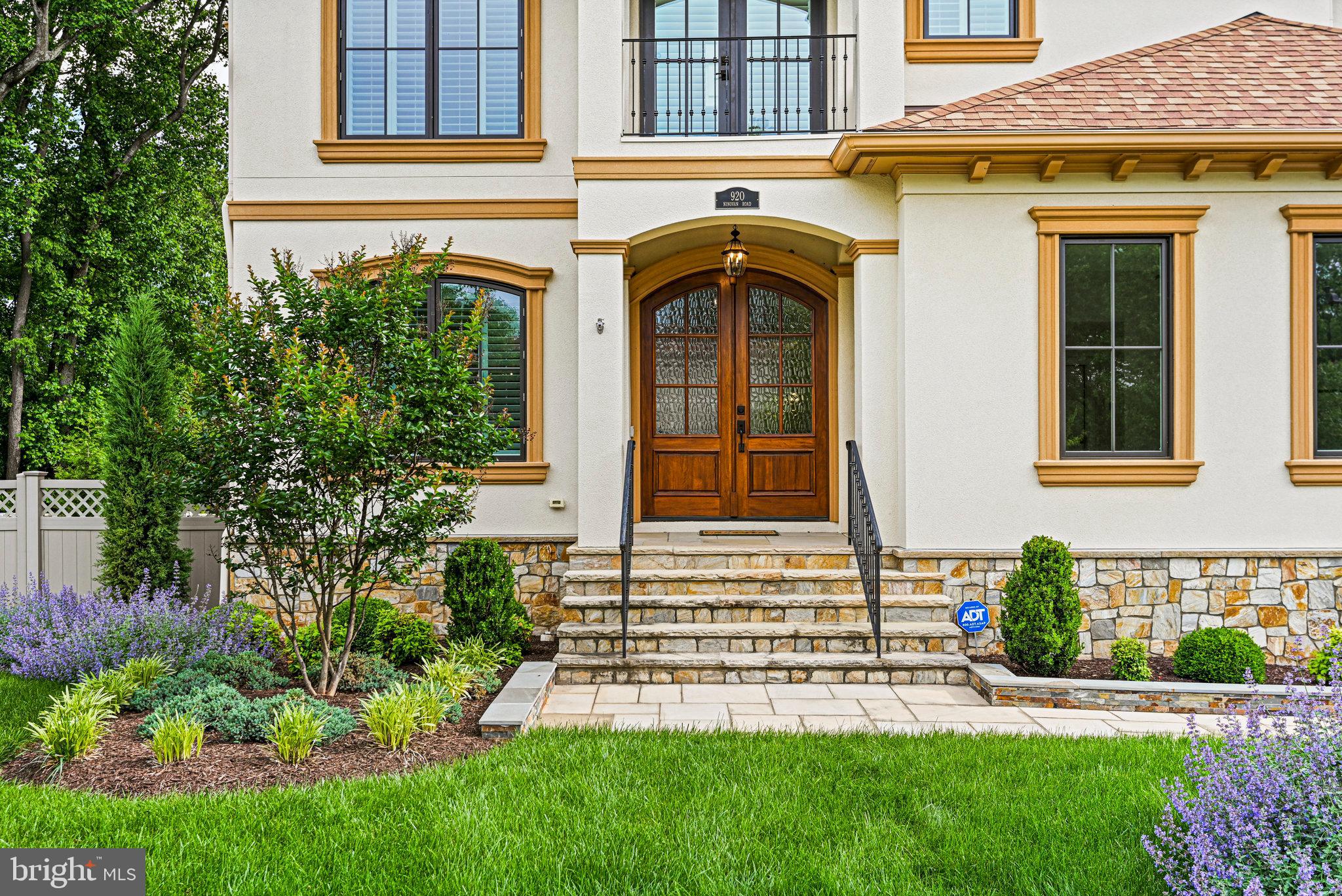 920 Ninovan Road Southeast Vienna, VA 22180 - Photo 3 of 44 a front view of a house with a garden