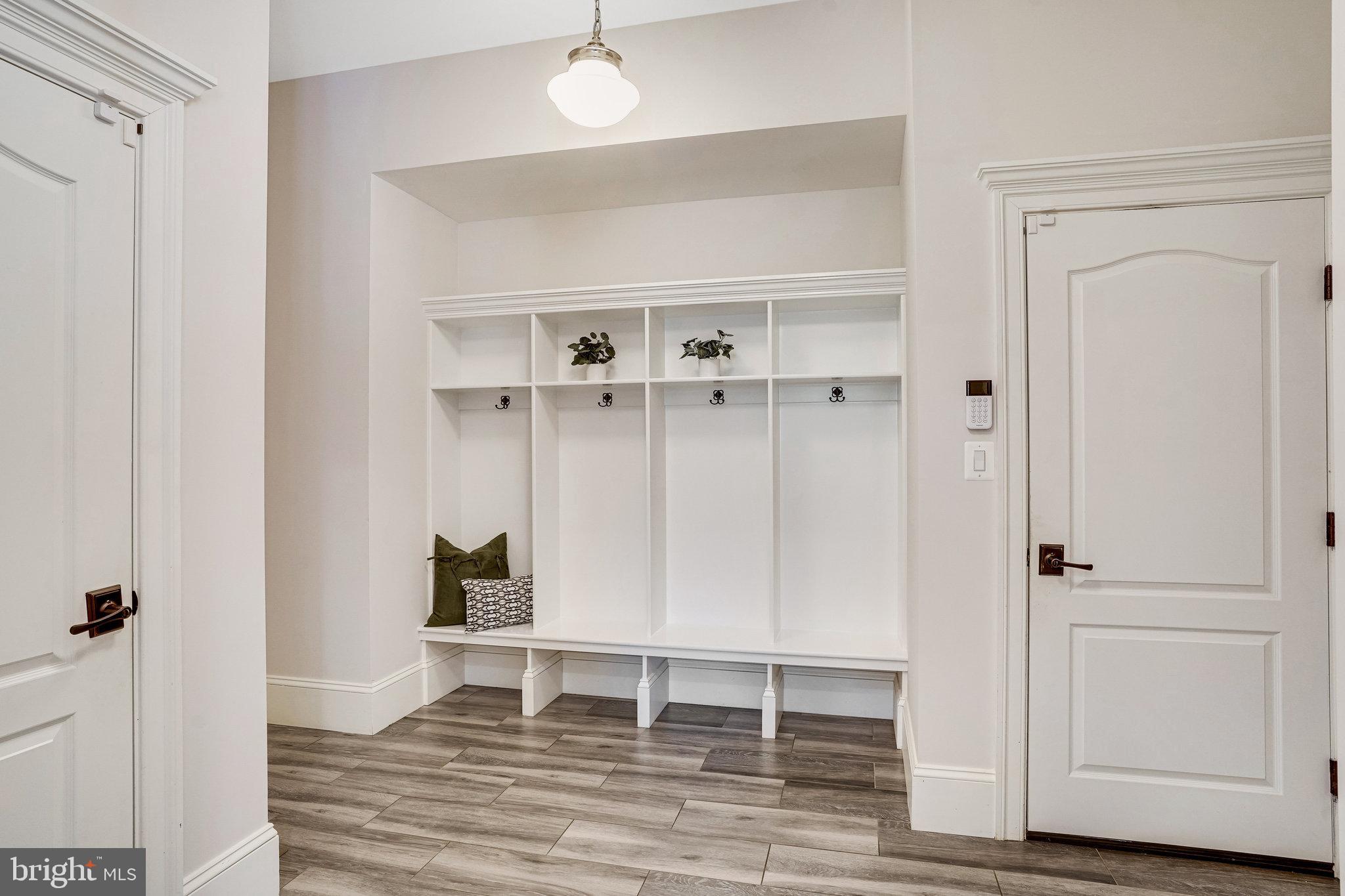 920 Ninovan Road Southeast Vienna, VA 22180 - Photo 32 of 44 an empty room with wooden floor closet and windows