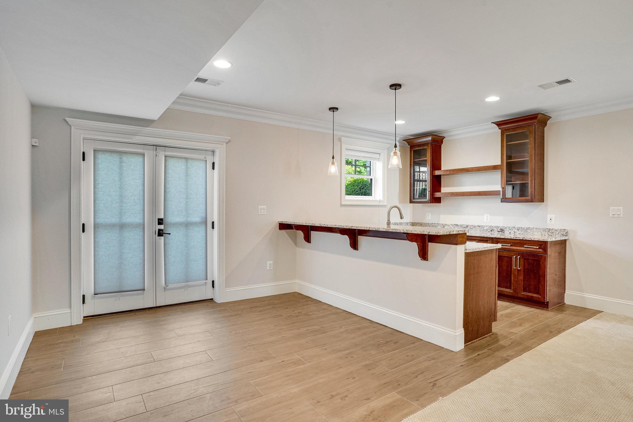 920 Ninovan Road Southeast Vienna, VA 22180 - Photo 38 of 44 a kitchen with stainless steel appliances granite countertop a sink and a refrigerator