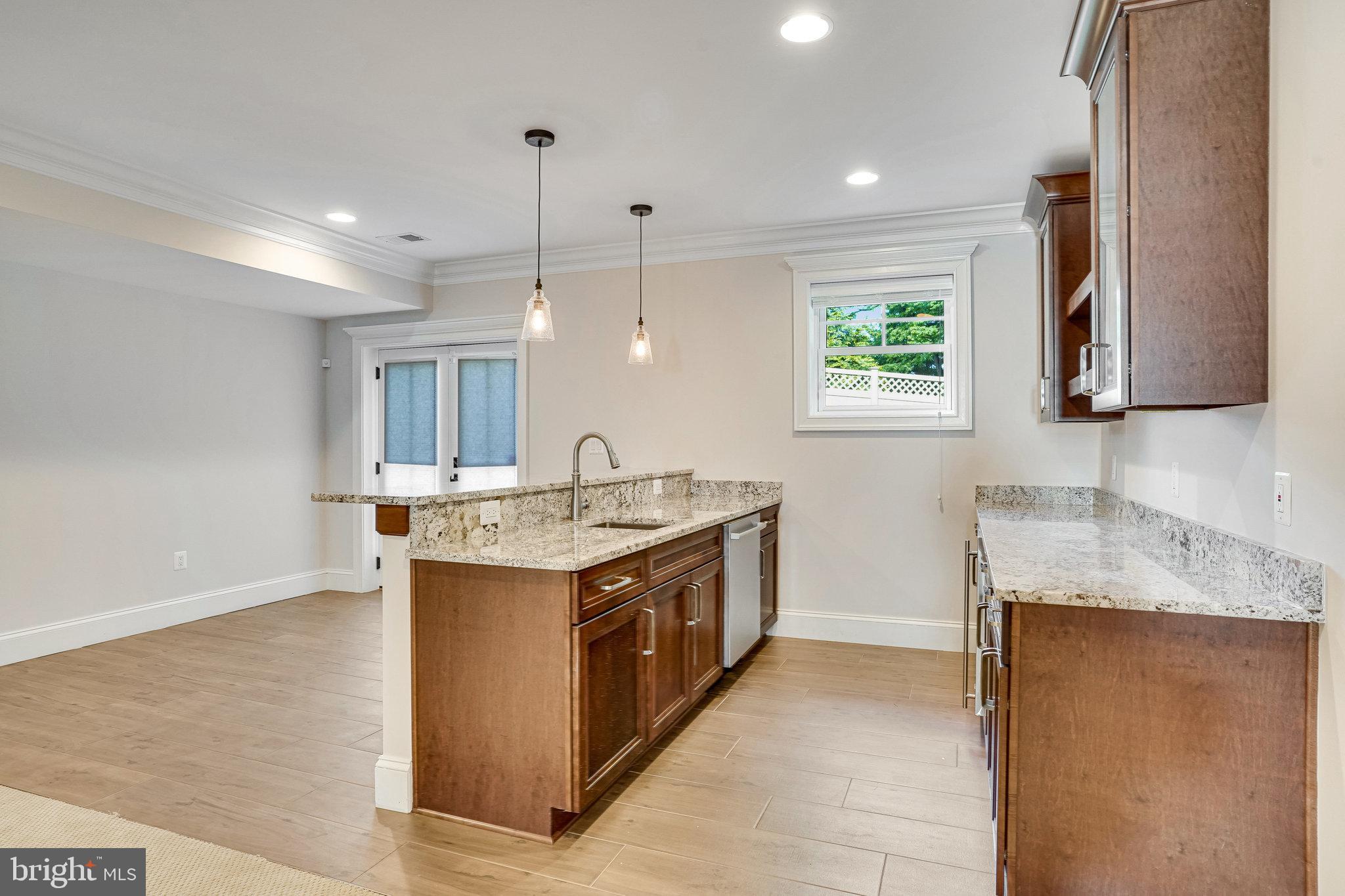 920 Ninovan Road Southeast Vienna, VA 22180 - Photo 39 of 44 a large kitchen with a stove and a sink