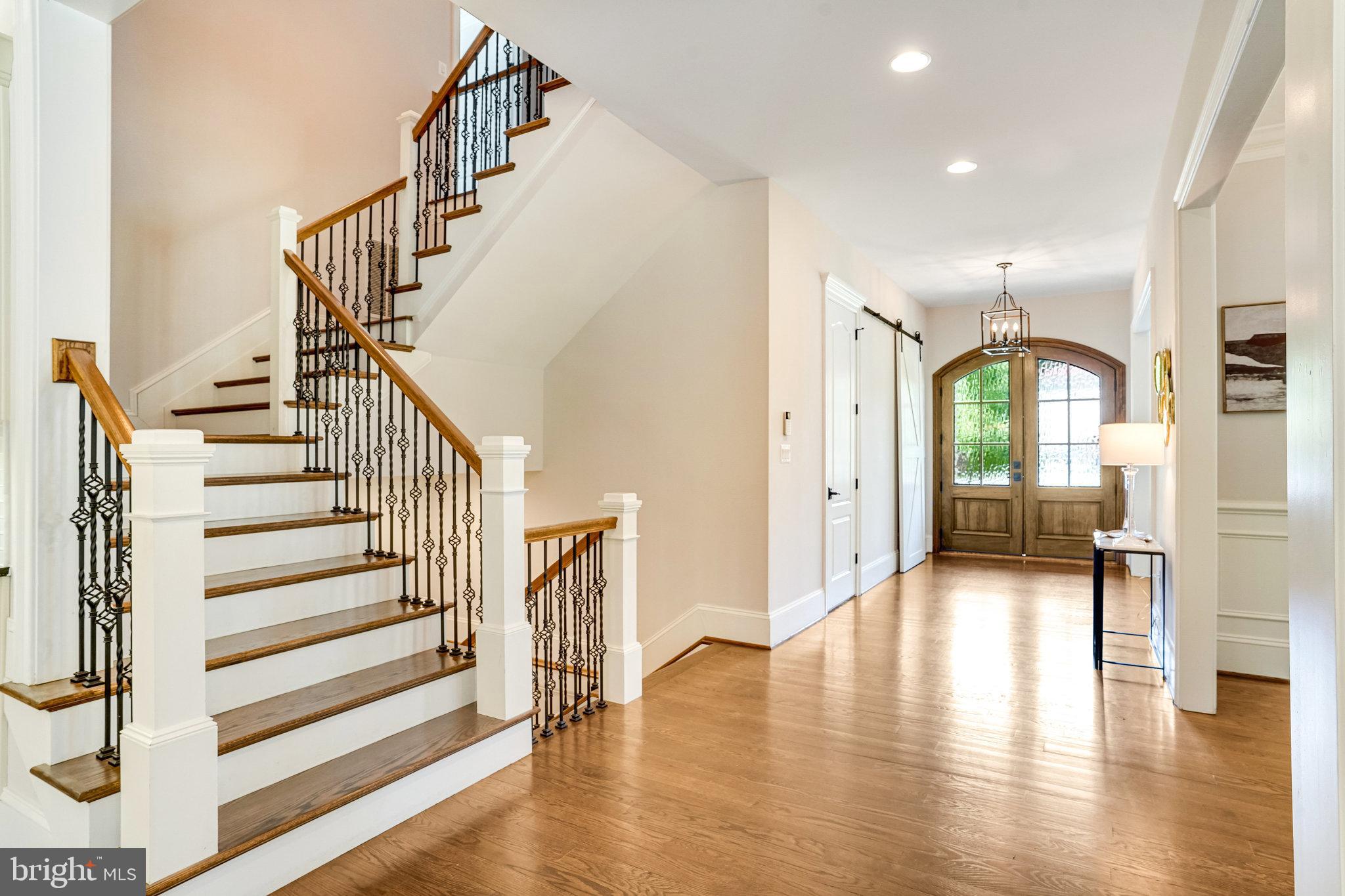 920 Ninovan Road Southeast Vienna, VA 22180 - Photo 5 of 44 a view of a hallway with entryway wooden floor and front door
