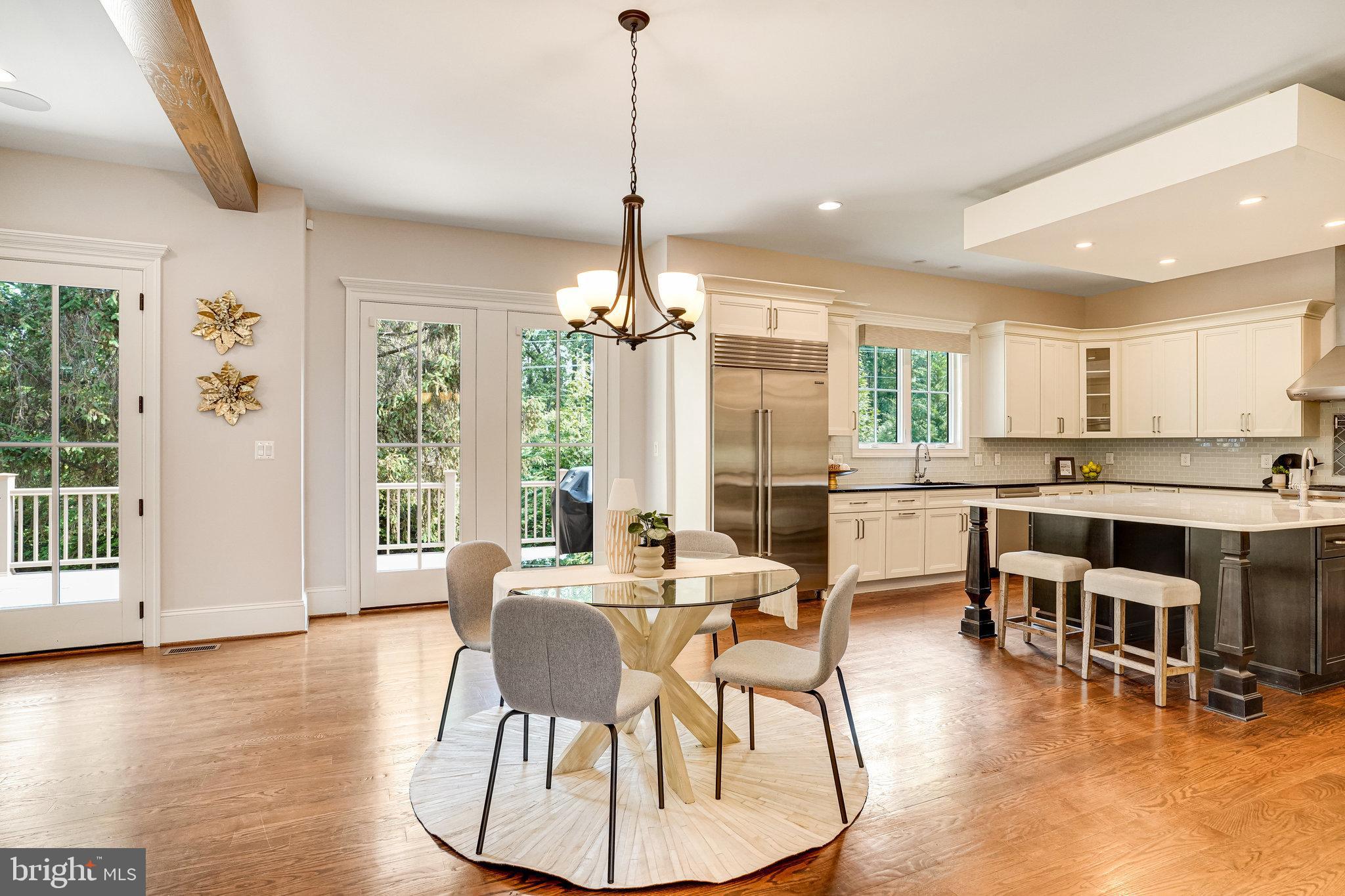 920 Ninovan Road Southeast Vienna, VA 22180 - Photo 10 of 44 a view of a dining room and livingroom with furniture wooden floor a chandelier
