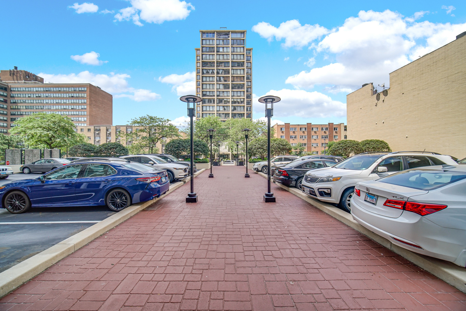 5733 North Sheridan Road, Unit 27C Chicago, IL 60660 - Photo 22 of 23 a view of cars parked in a parking lot