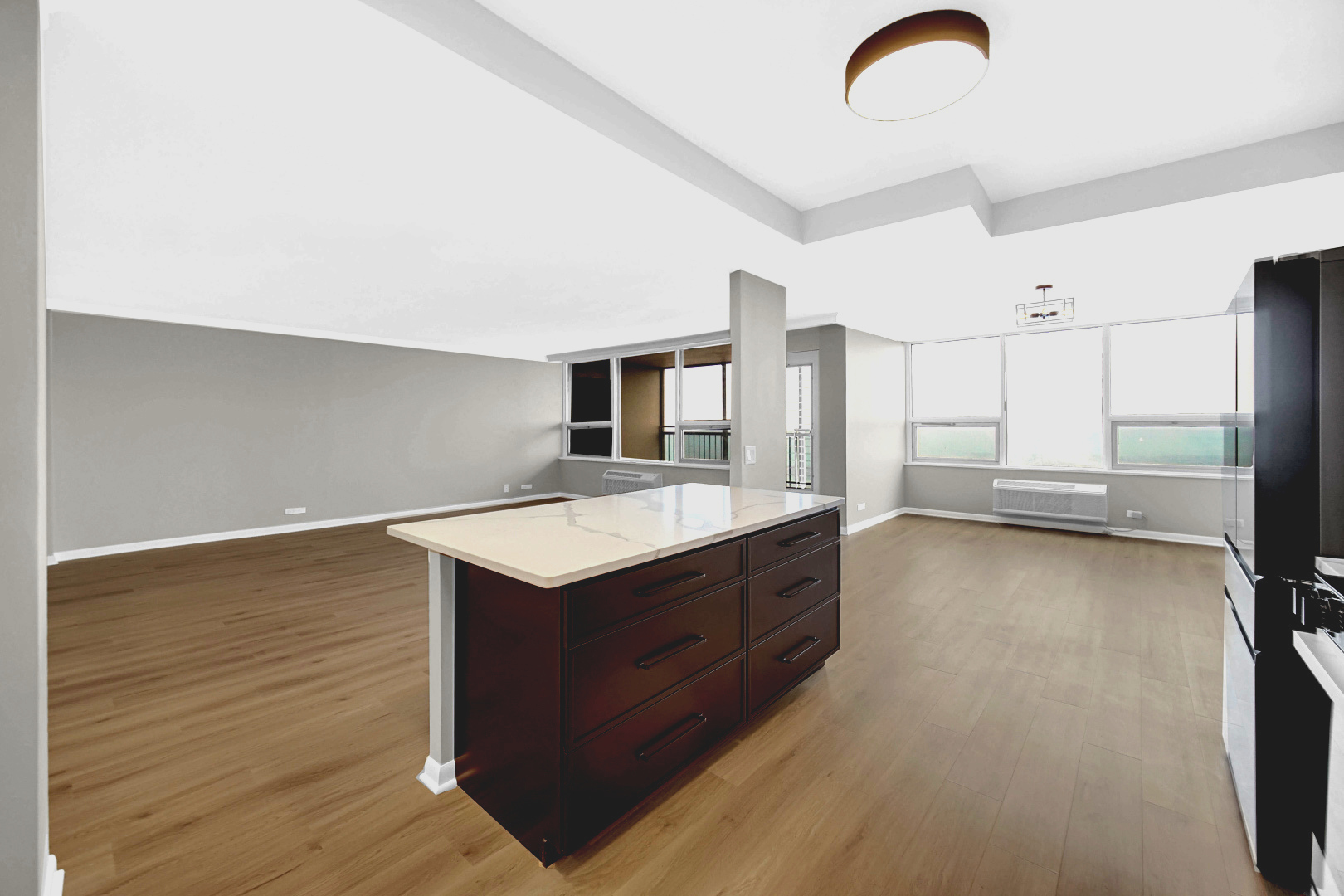 5733 North Sheridan Road, Unit 27C Chicago, IL 60660 - Photo 8 of 23 a kitchen with a stove and a refrigerator