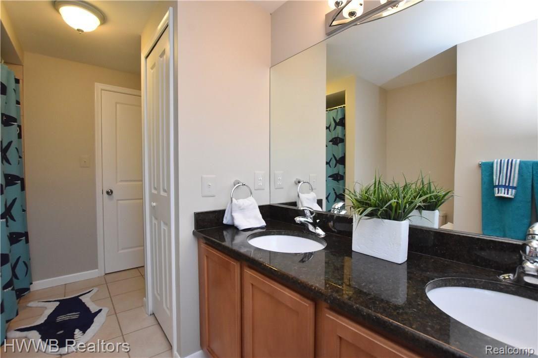 565 South Cranbrook Road Birmingham, MI 48009 - Photo 25 of 31 Hall Bathroom features double vanities