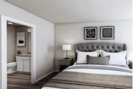 a bedroom with a bed and a view of bathroom