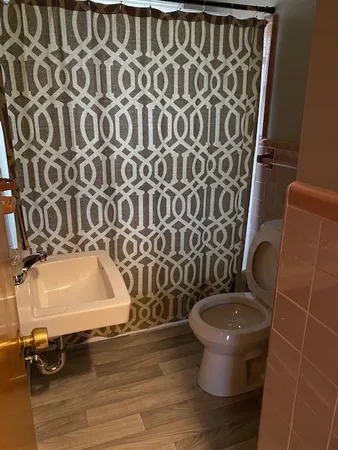a bathroom with a toilet and a sink