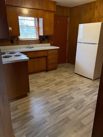 a kitchen with stainless steel appliances granite countertop a stove a refrigerator and a microwave