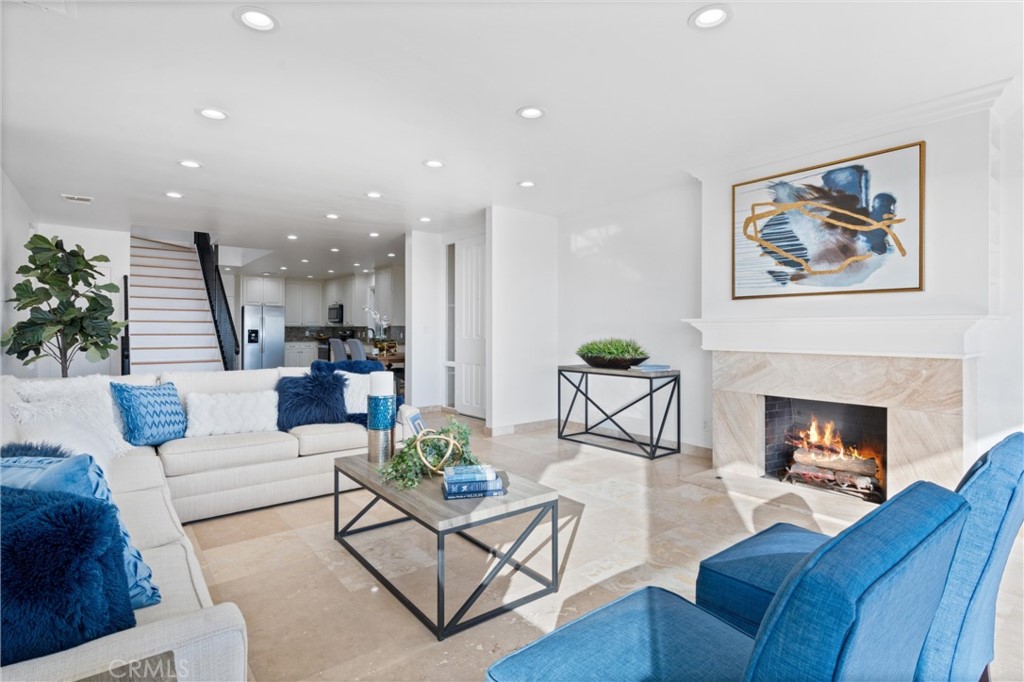2804 West Oceanfront Newport Beach, CA 92663 - Photo 3 of 16 a living room with furniture and a fireplace