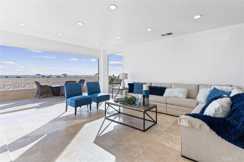 2804 West Oceanfront Newport Beach, CA 92663 - Photo 4 of 16 a living room with furniture and a rug