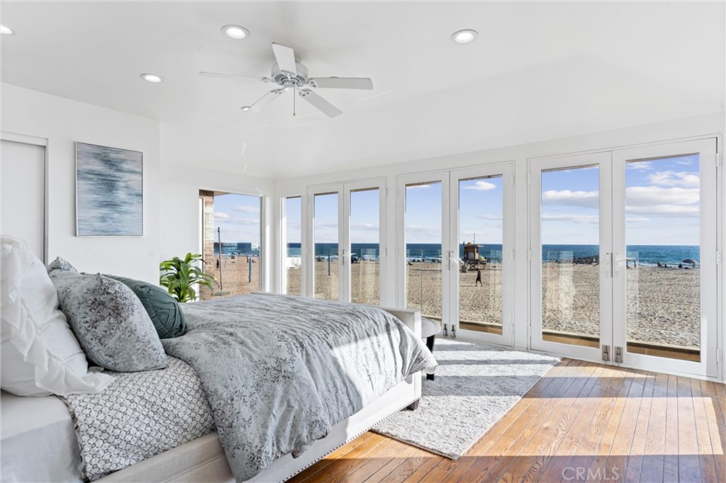 2804 West Oceanfront Newport Beach, CA 92663 - Photo 8 of 16 a living room with a bed furniture and a large window