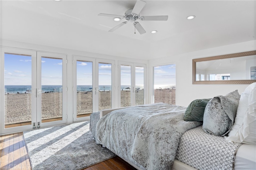 2804 West Oceanfront Newport Beach, CA 92663 - Photo 9 of 16 a spacious bedroom with a bed and glass walk in closet