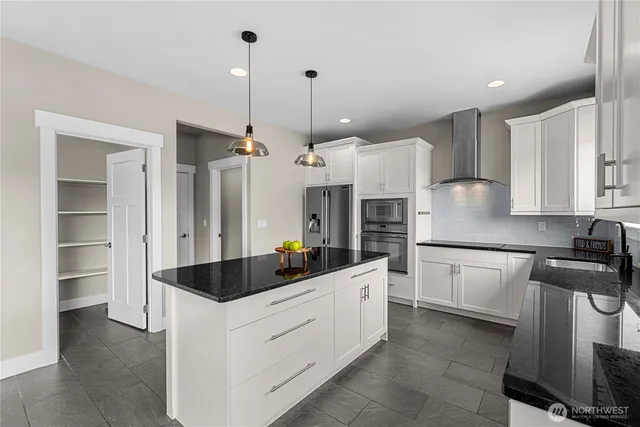 a kitchen with sink and window