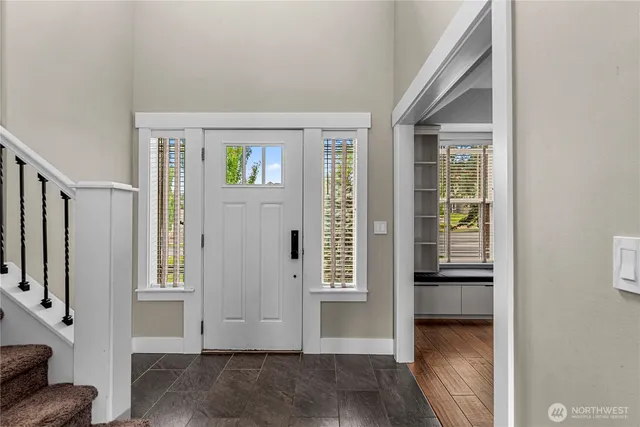 a room with a window and a wooden floor