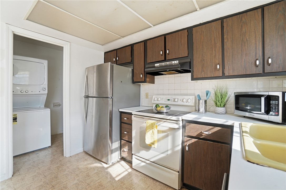5414 Lamme Road Dayton, OH 45439 - Photo 19 of 32 This kitchen boasts ample cabinet storage and essential appliances, creating a practical culinary space.