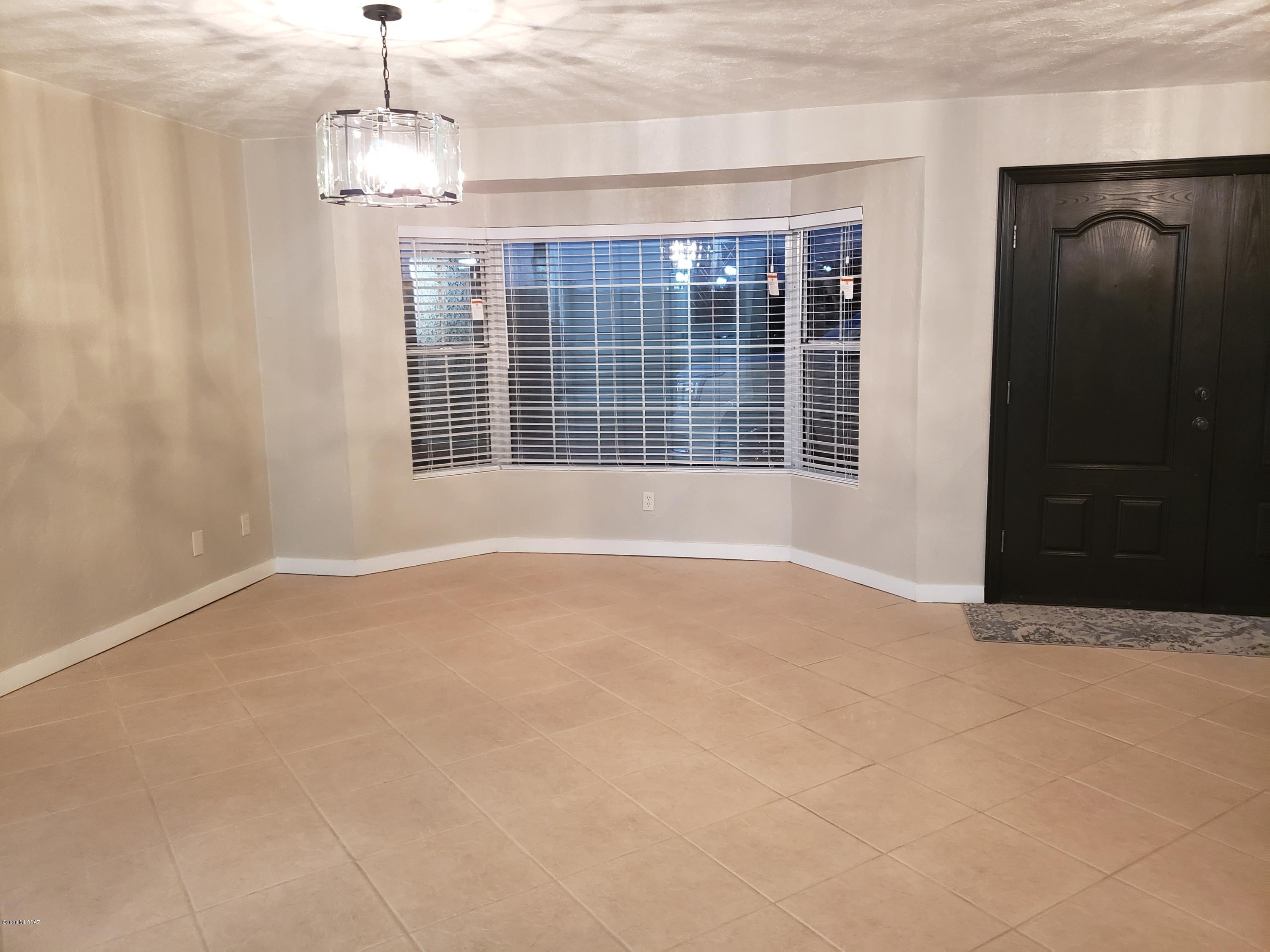 182 Pita Court Rio Rico, AZ 85648 - Photo 8 of 46 a view of an empty room with a window