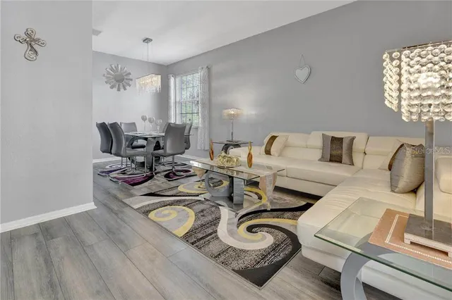 a living room with furniture and a window