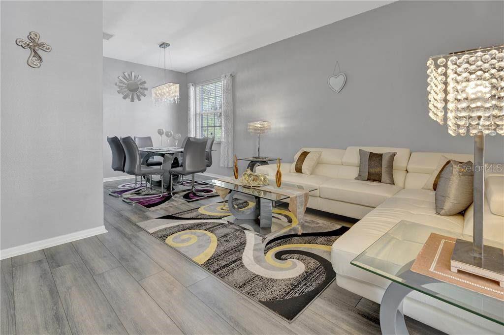 12847 Solola Way Trinity, FL 34655 - Photo 22 of 39 a living room with furniture and a window