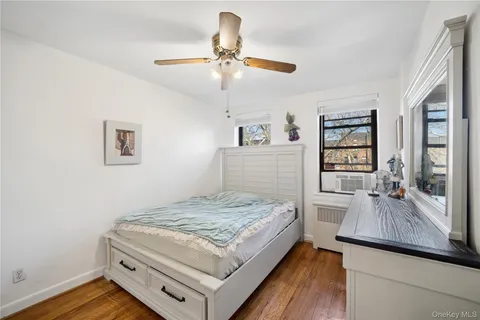 a living room with hard wood flooring and a couch