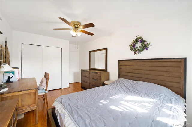 a bedroom with a bed and cabinet