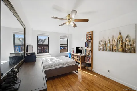 a bedroom with a bed furniture and a window