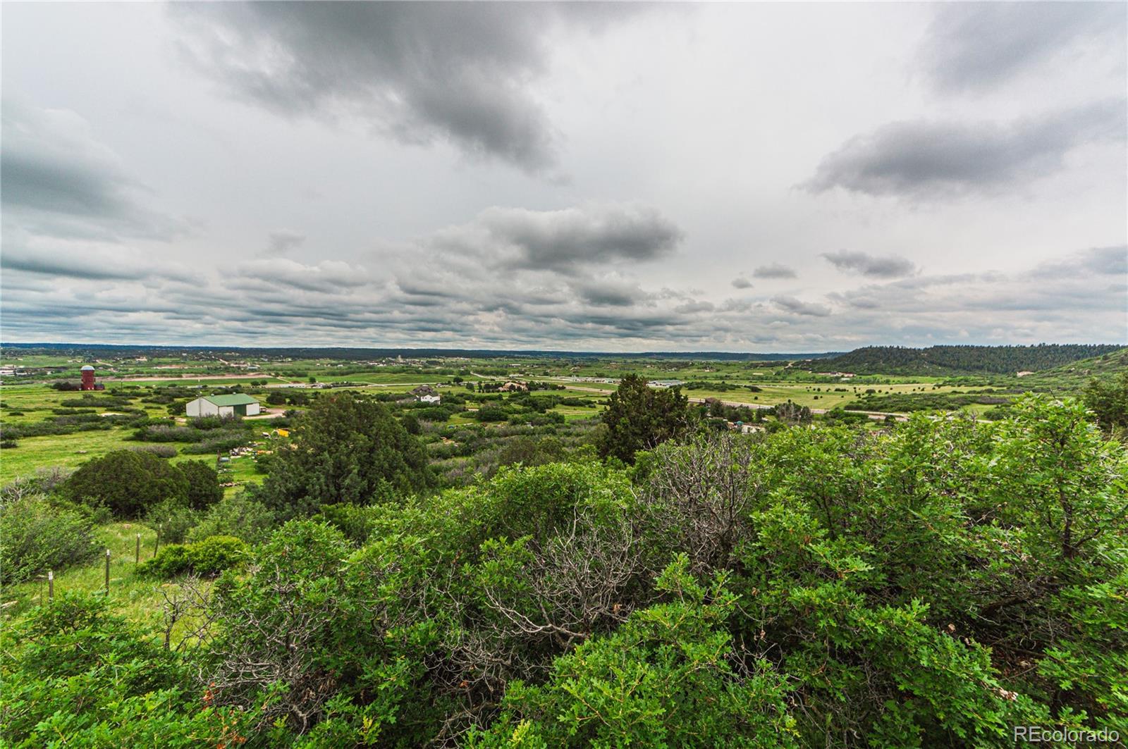 86 Highway 86 Franktown, CO 80116 - Photo 17 of 30 a view of a large body of water with lots of green space