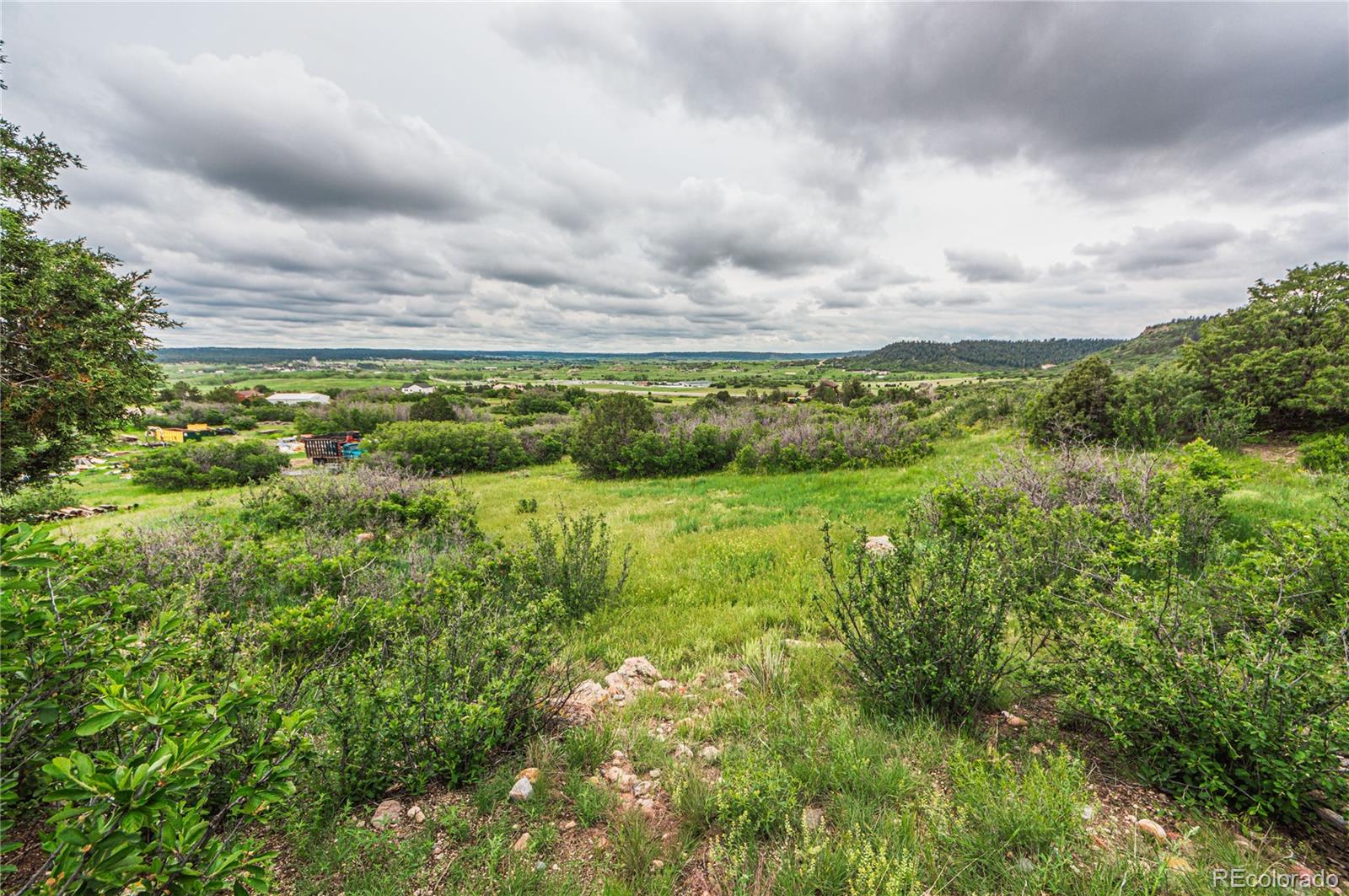 86 Highway 86 Franktown, CO 80116 - Photo 10 of 30 a view of a lake with houses in back