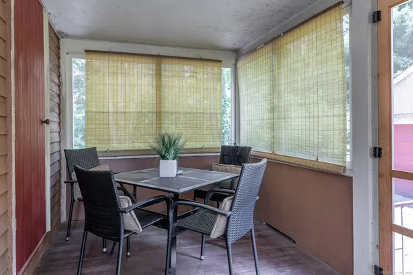 a view of a dining room with furniture and window
