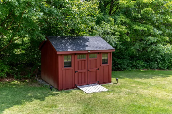 a backyard of a house with lots of green space