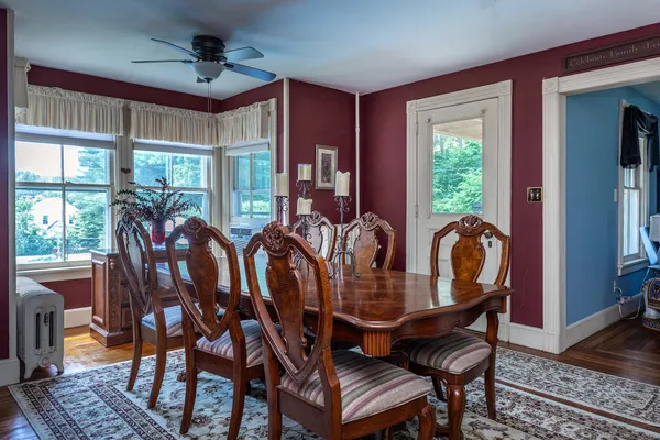 a view of a dining room with furniture window and wooden floor