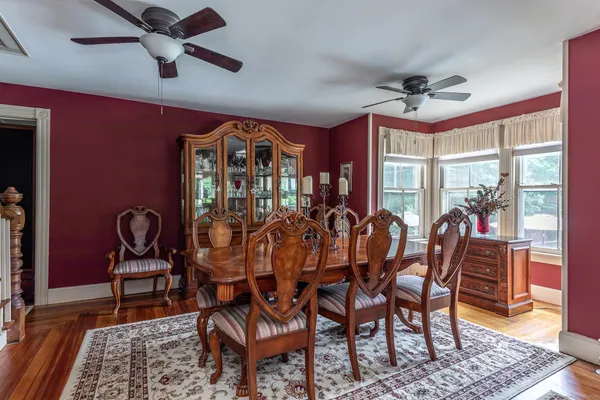 a view of a dining room with furniture window and wooden floor