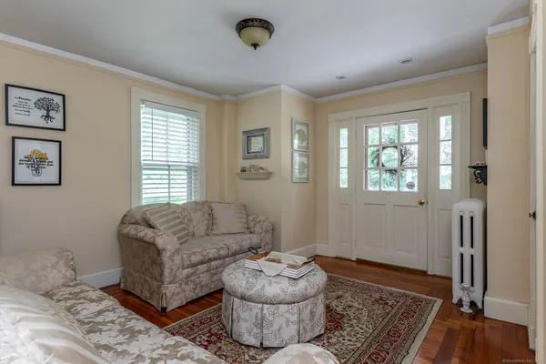 a living room with furniture and a window