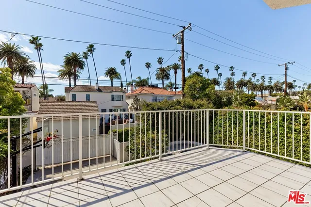 a view of a balcony with potted plants