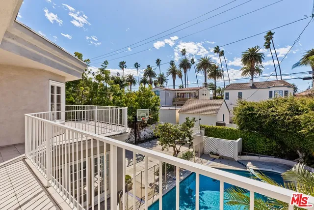 a view of a house with staircase and plants