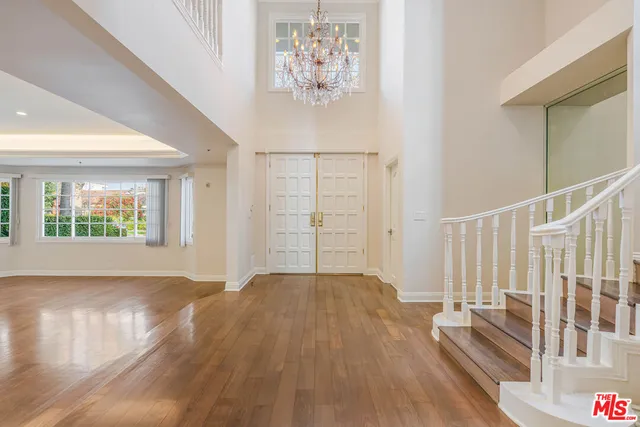 a view of entryway with wooden floor