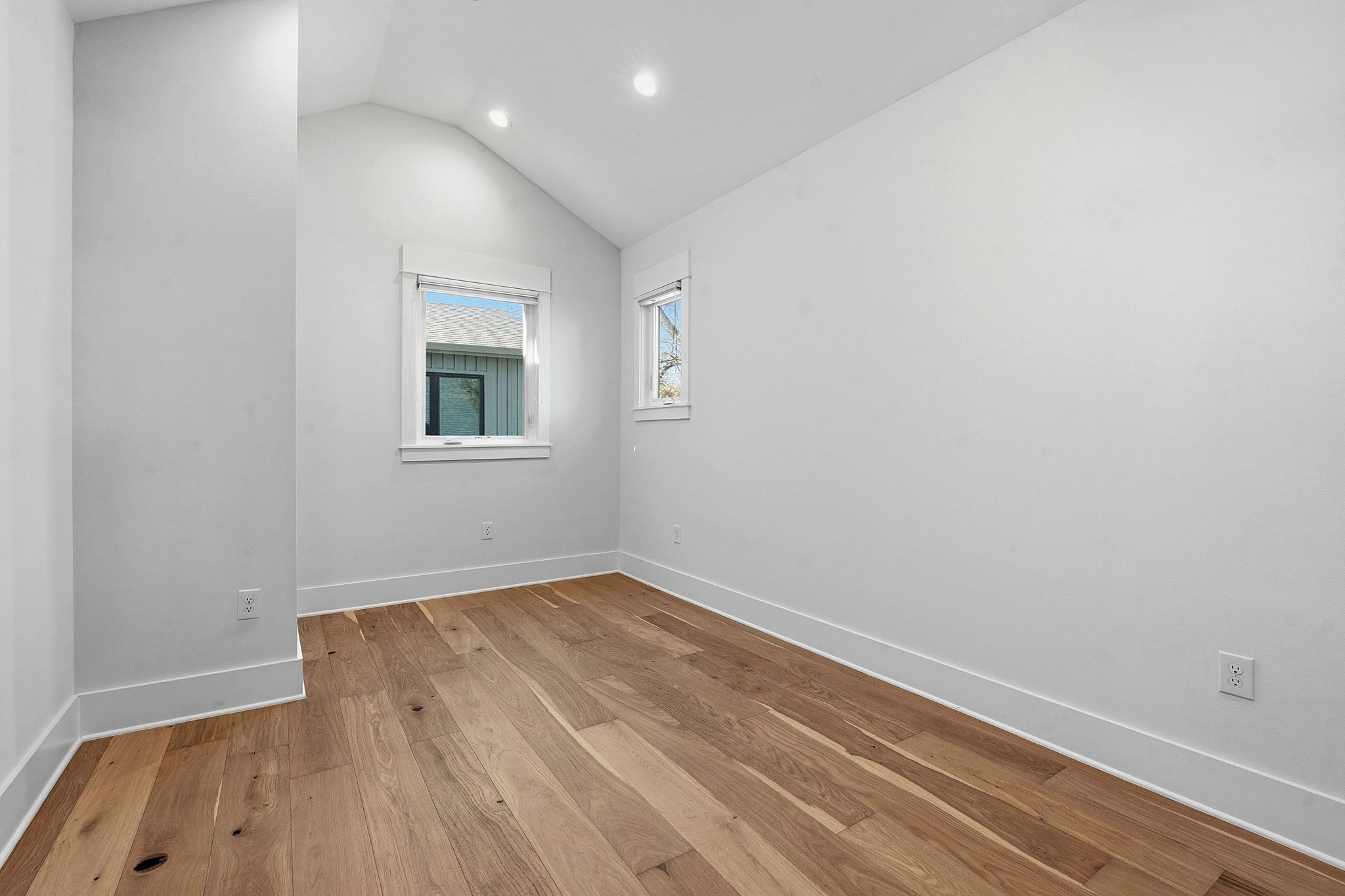2921 Lyons Road, Unit 1 Austin, TX 78702 - Photo 14 of 20 an empty room with wooden floor and windows