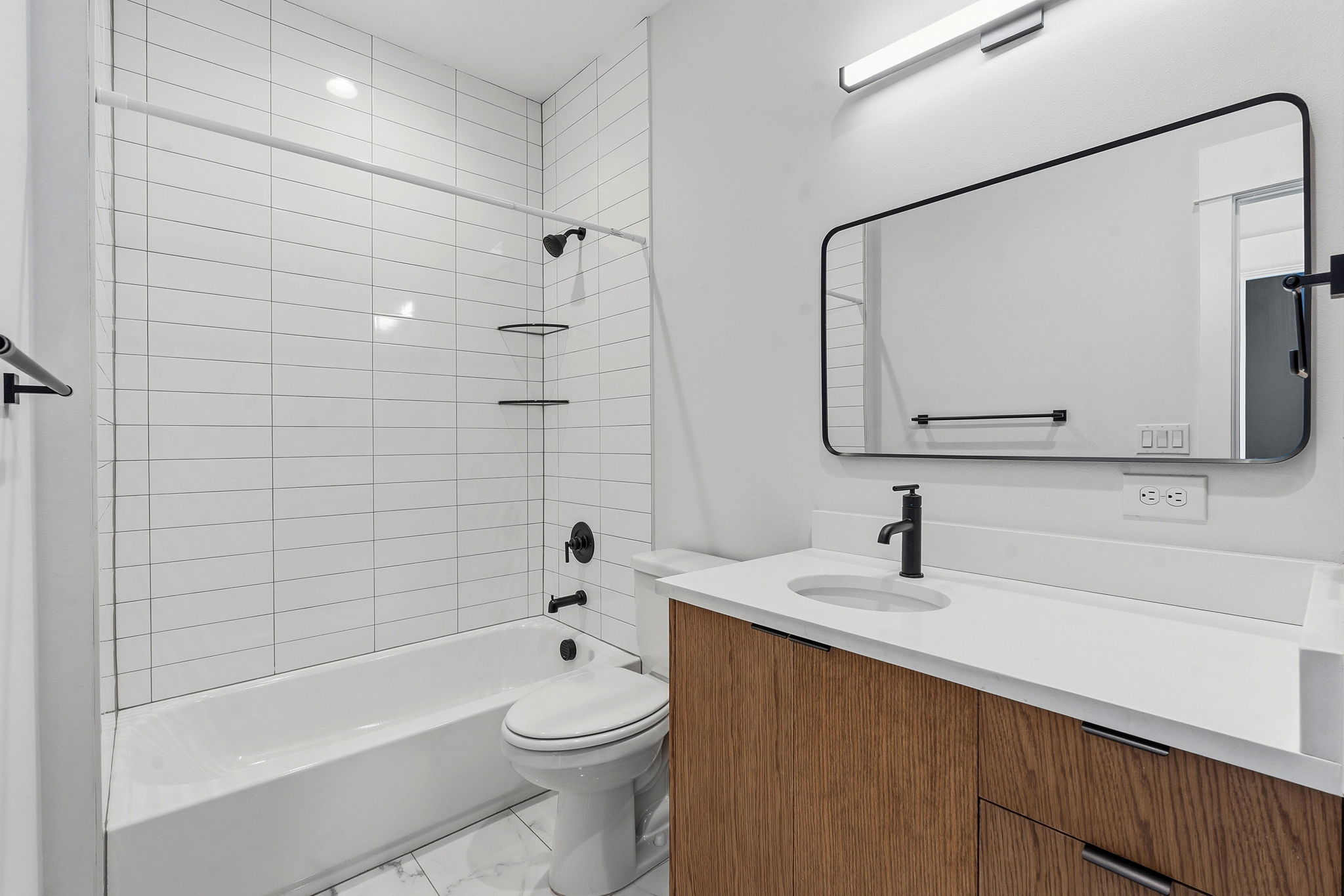 2921 Lyons Road, Unit 1 Austin, TX 78702 - Photo 15 of 20 a bathroom with a sink a toilet and shower