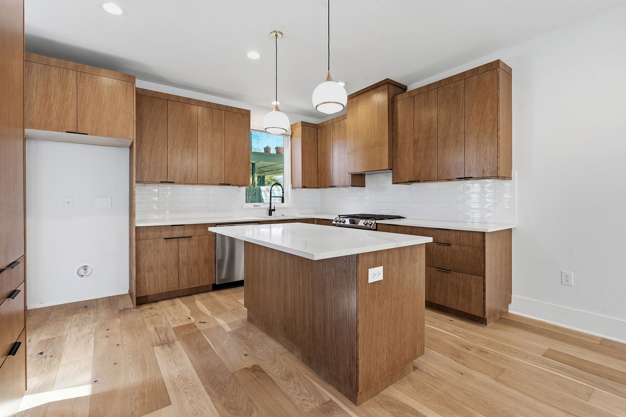 2921 Lyons Road, Unit 1 Austin, TX 78702 - Photo 5 of 20 a kitchen with a sink a counter top space and cabinets