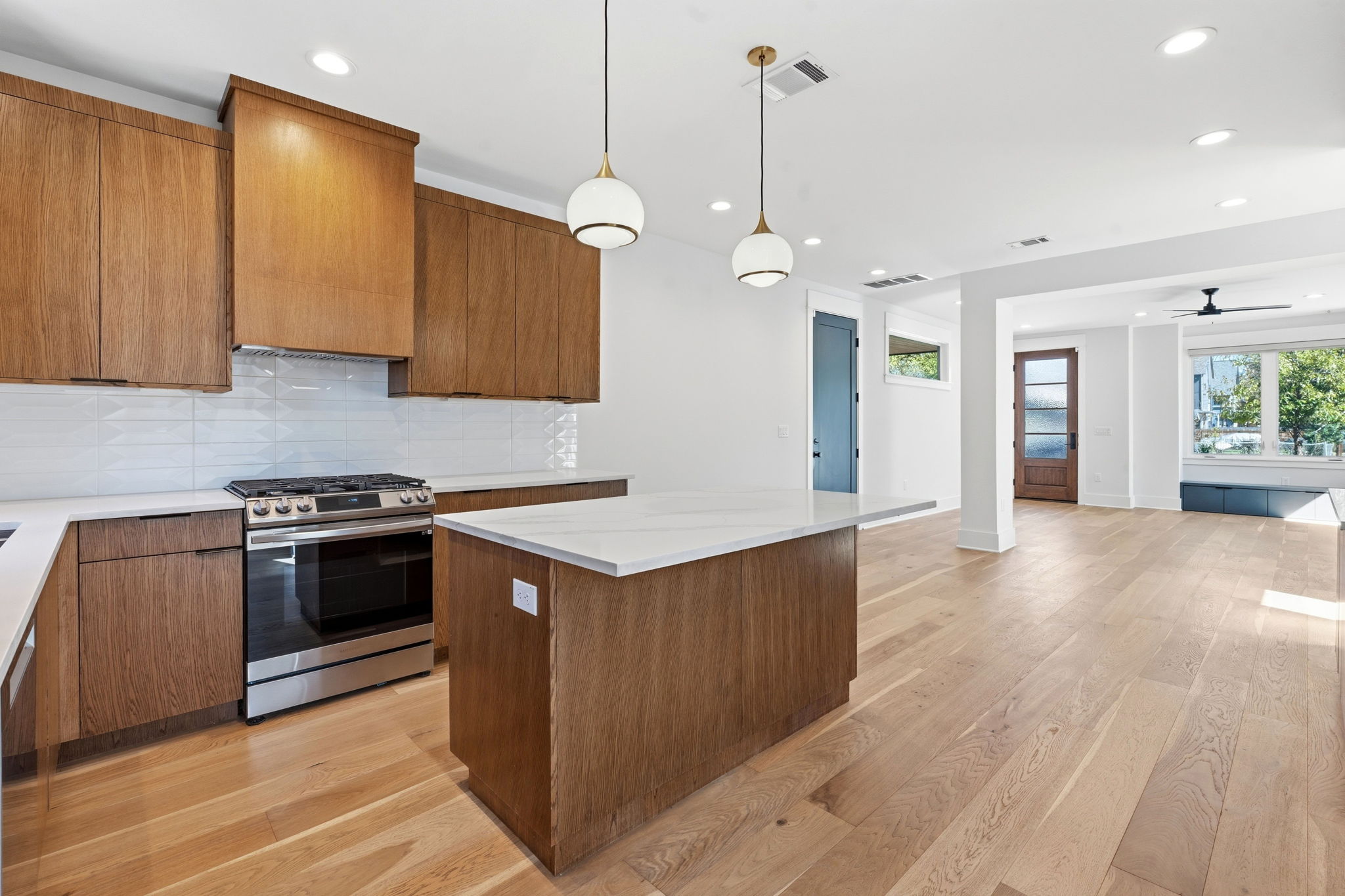 2921 Lyons Road, Unit 1 Austin, TX 78702 - Photo 8 of 20 a kitchen with stainless steel appliances granite countertop a stove and a refrigerator