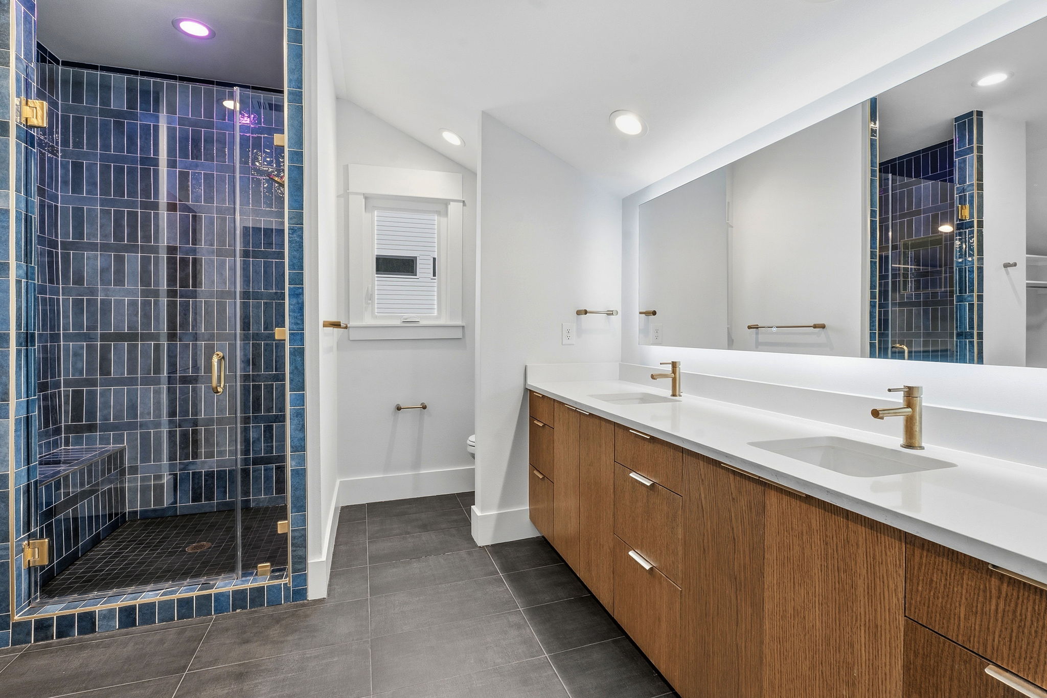 2921 Lyons Road, Unit 1 Austin, TX 78702 - Photo 10 of 20 a bathroom with a double vanity sink a toilet and shower