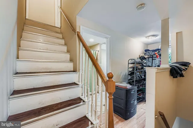 a view of staircase with wooden floor and stairs