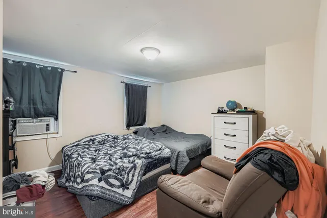 a bedroom with bed and a couch